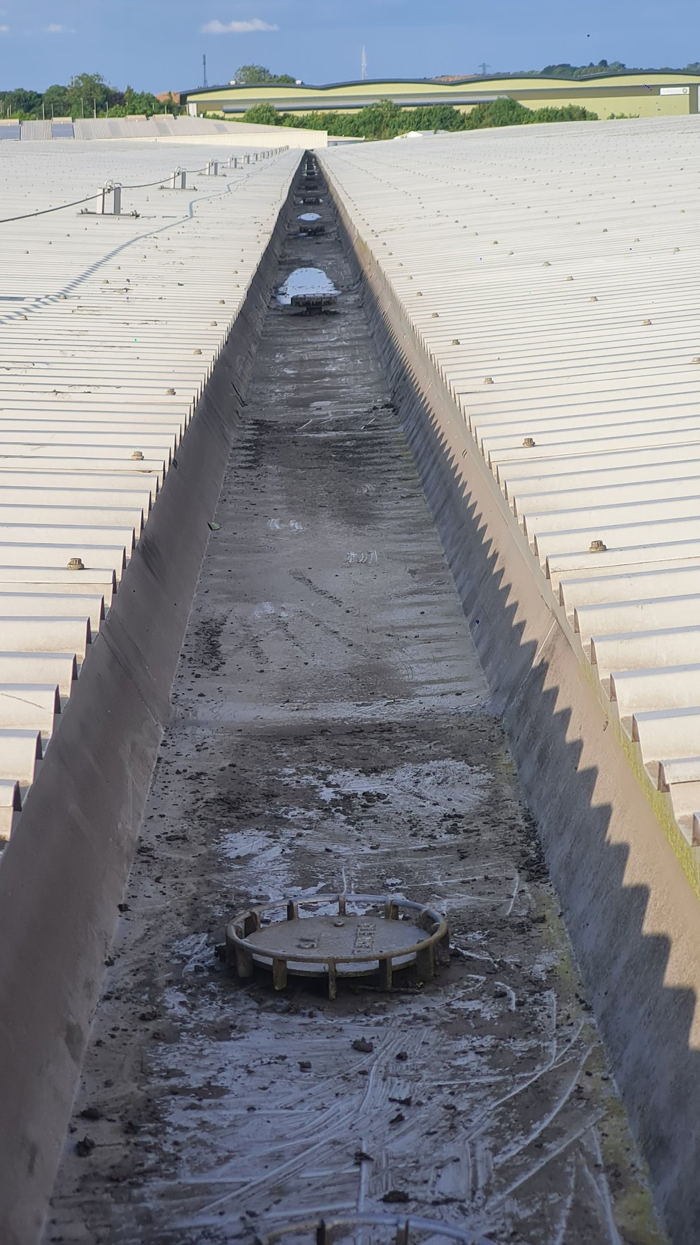 Cleared valley gutter on a commercial roof