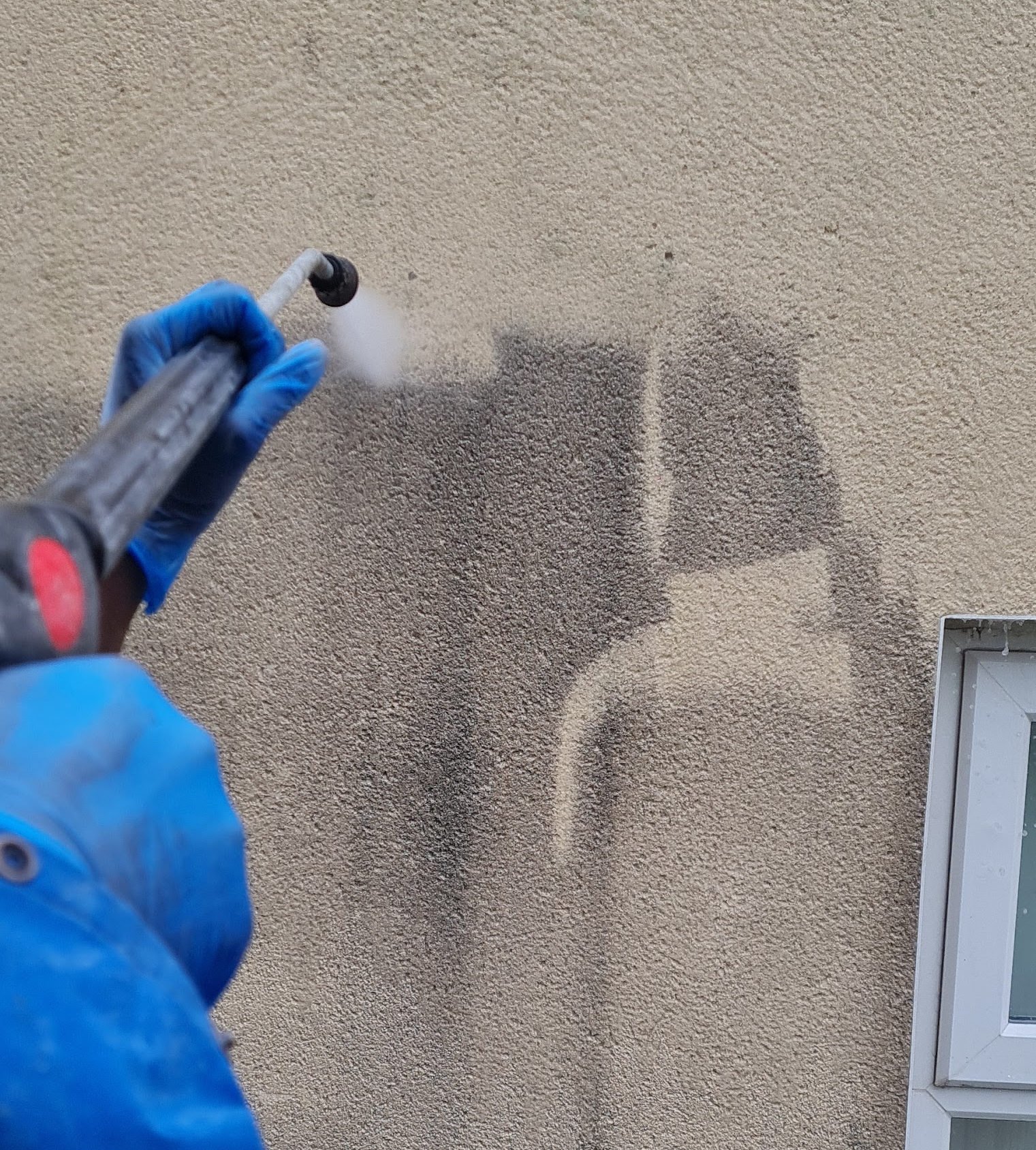 Washing down a rendered elevation